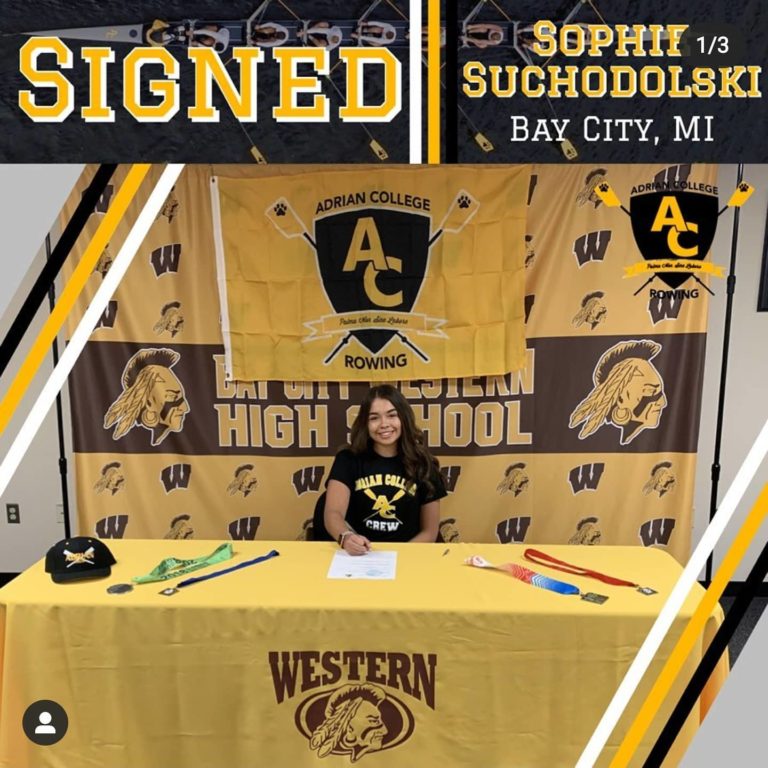 Sophie at signing celebration table at Bay City Western – Adrian College
